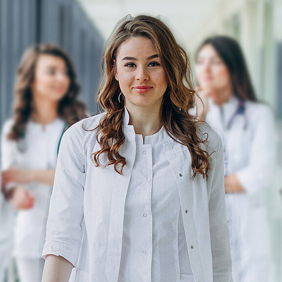 young-female-doctor-posing-corridor-hospital.jpg