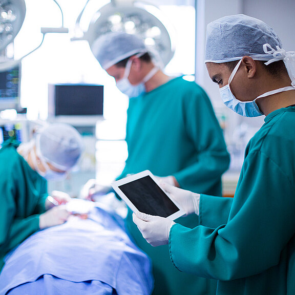 surgeon-using-digital-tablet-operation-theater.jpg